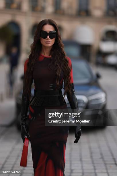 Sabina Jakubowicz seen wearing a Loewe dress with a bag by Coperni, Balenciaga sunglasses and shoes by Yves Saint Laurent, outside Loewe during Paris...