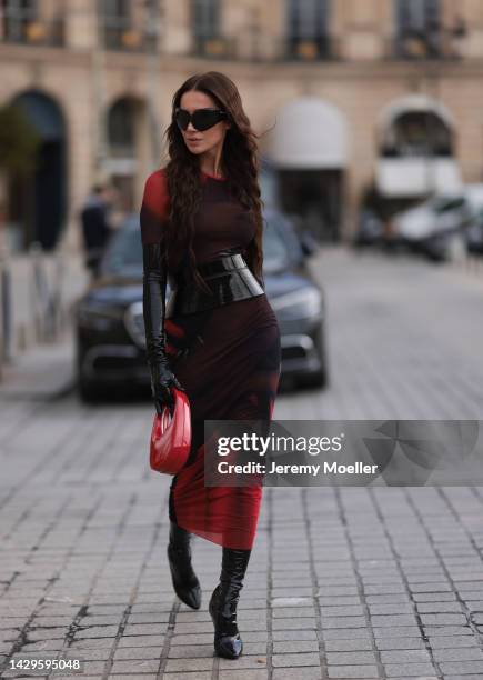 Sabina Jakubowicz seen wearing a Loewe dress with a bag by Coperni, Balenciaga sunglasses and shoes by Yves Saint Laurent, outside Loewe during Paris...