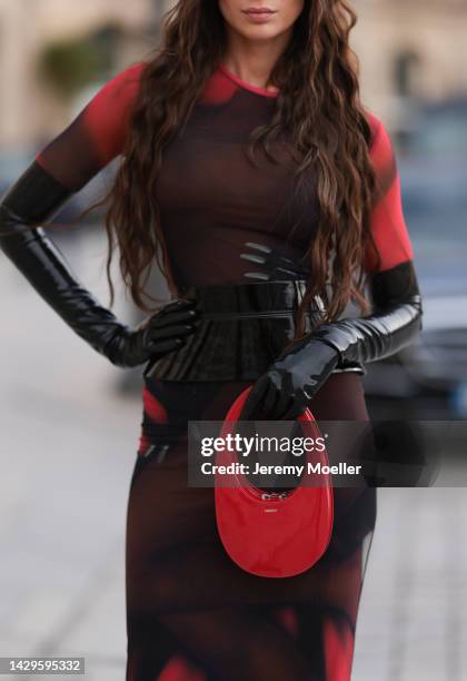 Sabina Jakubowicz seen wearing a Loewe dress with a bag by Coperni, Balenciaga sunglasses and shoes by Yves Saint Laurent, outside Loewe during Paris...