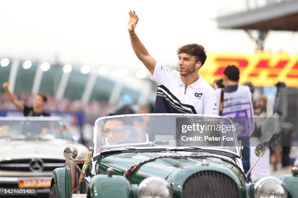 Pierre Gasly of France and Scuderia AlphaTauri waves to the crowd on the drivers parade prior to the F1 Grand Prix of Singapore at Marina Bay Street...