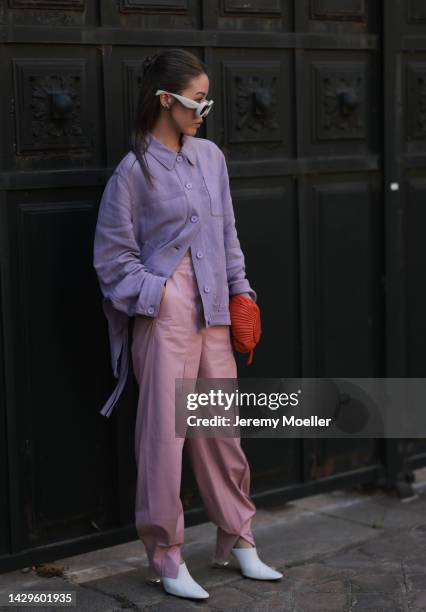 Jenny Tsang seen wearing white Loewe sunglasses and a Loewe bag, outside Loewe during Paris Fashion Week on September 30, 2022 in Paris, France.