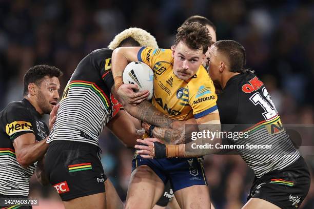 Clinton Gutherson of the Eels is tackled during the 2022 NRL Grand Final match between the Penrith Panthers and the Parramatta Eels at Accor Stadium...