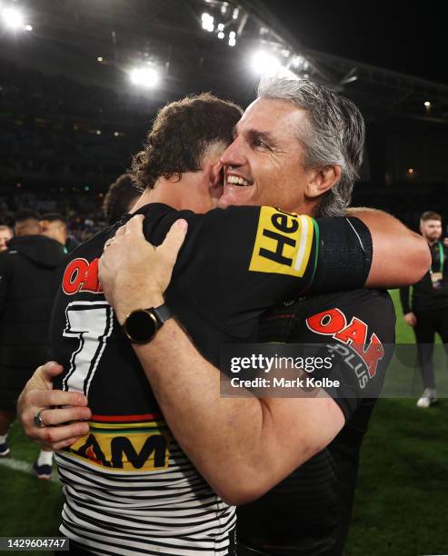 Nathan Cleary of the Panthers and Panthers coach Ivan Cleary embrace as they celebrat victory in the 2022 NRL Grand Final match between the Penrith...