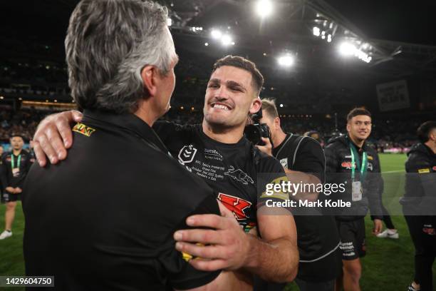 Nathan Cleary of the Panthers and Panthers coach Ivan Cleary embrace as they celebrat victory in the 2022 NRL Grand Final match between the Penrith...