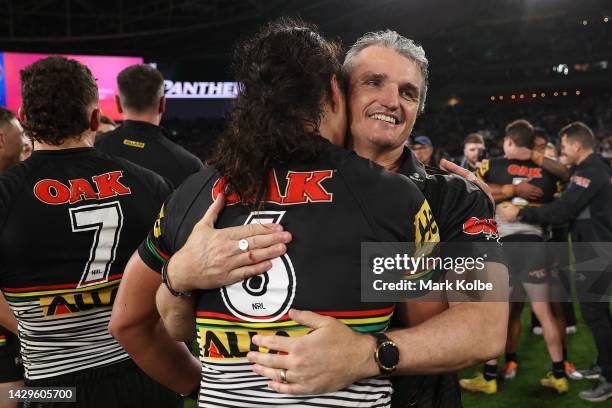 Jarome Luai of the Panthers and Panthers coach Ivan Cleary embrace as they celebrat victory in the 2022 NRL Grand Final match between the Penrith...