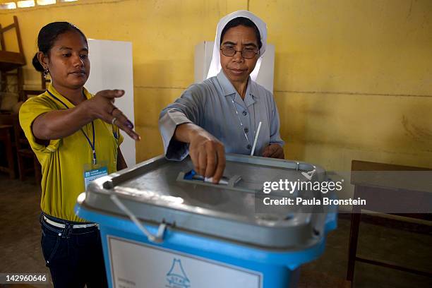 An East Timorese nun casts her ballot in the run-off Presidential elections on April 16, 2012 in Dili, East Timor. The second round run-off,...
