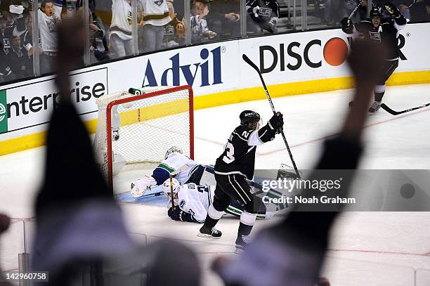 Dustin Brown of the Los Angeles Kings reacts after scoring the winning goal against the Vancouver Canucks in Game Three of the Western Conference...