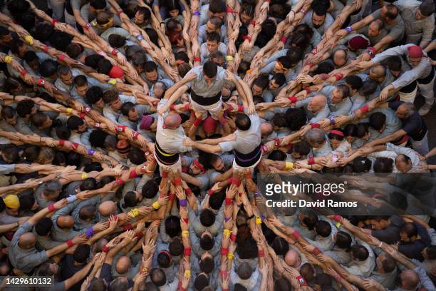 Members of the colla 'Castellers de Sants' build a human tower during the 28th Tarragona Competition on October 2, 2022 in Tarragona, Spain. The...