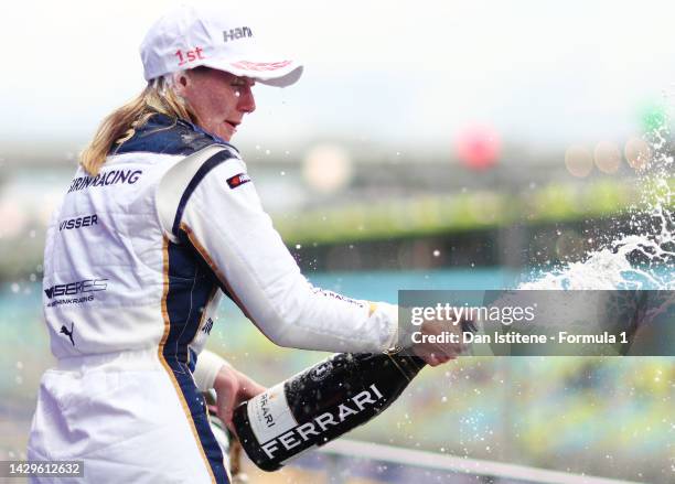 Race winner Beitske Visser of Netherlands and Sirin Racing celebrates on the podium during the W Series Round 6 race at Marina Bay Street Circuit on...