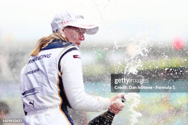 Race winner Beitske Visser of Netherlands and Sirin Racing celebrates on the podium during the W Series Round 6 race at Marina Bay Street Circuit on...