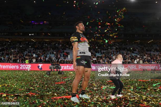 Apisai Koroisau of the Panthers throws confetti following victory during the 2022 NRL Grand Final match between the Penrith Panthers and the...