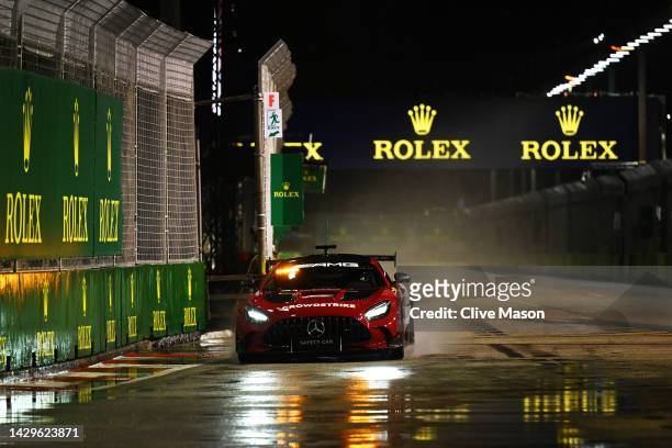 The FIA Safety Car drives on a wet track prior to the F1 Grand Prix of Singapore at Marina Bay Street Circuit on October 02, 2022 in Singapore,...