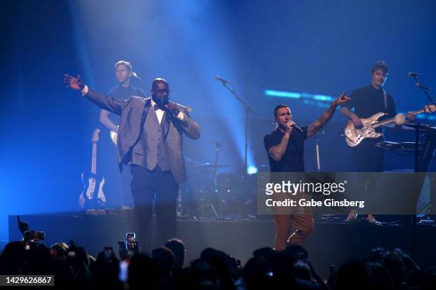 Shaquille O'Neal performs with Guitarist Mickey Madden, singer Adam Levine and bassist Sam Farrar of Maroon 5 during The Event hosted by the...