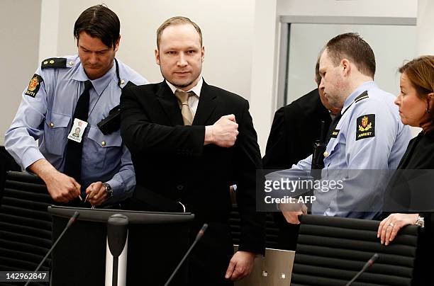 Rightwing extremist Anders Behring Breivik, who killed 77 people in twin attacks in Norway last year, makes a farright salute as he enters court in...