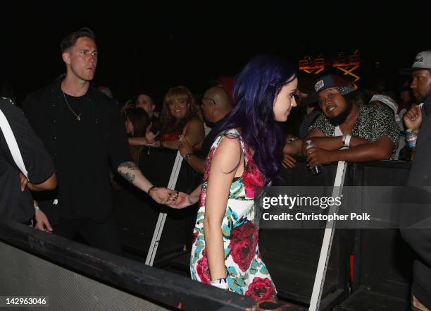 Musician Robert Ackroyd and singer Katy Perry in the audience during day 3 of the 2012 Coachella Valley Music & Arts Festival at the Empire Polo...