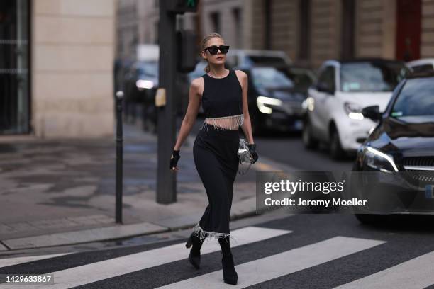 Tamaraah Al Gabaani wearing a two-piece by Stoud and a ByFar silver bag on September 29, 2022 in Paris, France.