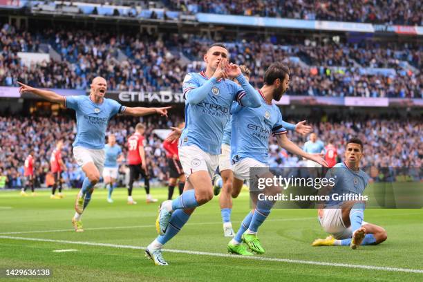 Phil Foden of Manchester City celebrates their sides first goal during the Premier League match between Manchester City and Manchester United at...