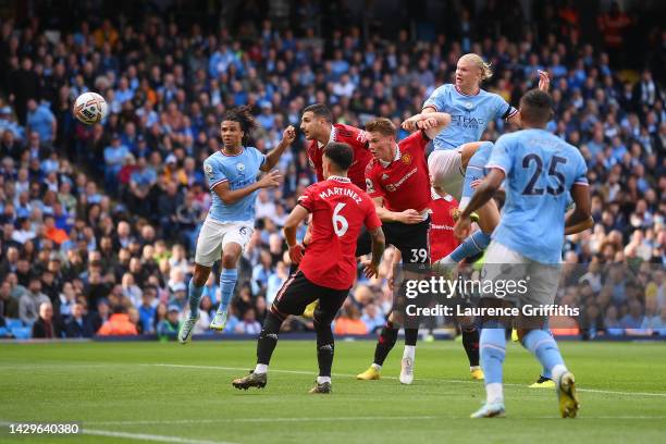 Erling Haaland of Manchester City scores their sides second goal during the Premier League match between Manchester City and Manchester United at...