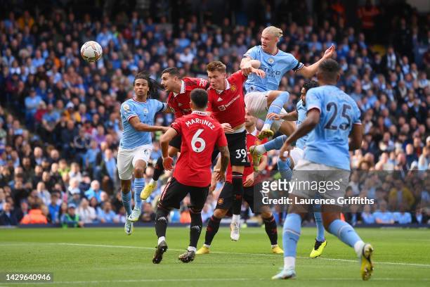 Erling Haaland of Manchester City scores their sides second goal during the Premier League match between Manchester City and Manchester United at...