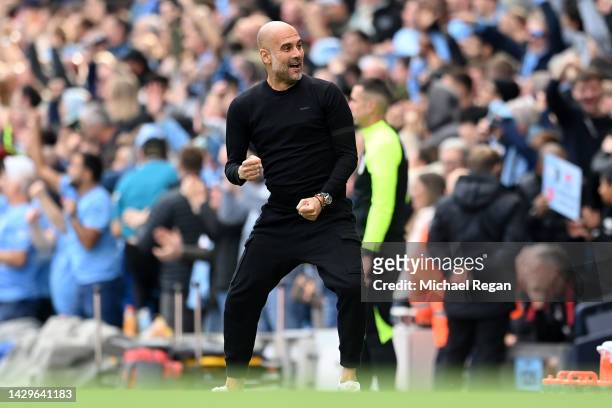 Pep Guardiola, Manager of Manchester City, celebrates as Erling Haaland of Manchester City scores their sides second goal during the Premier League...