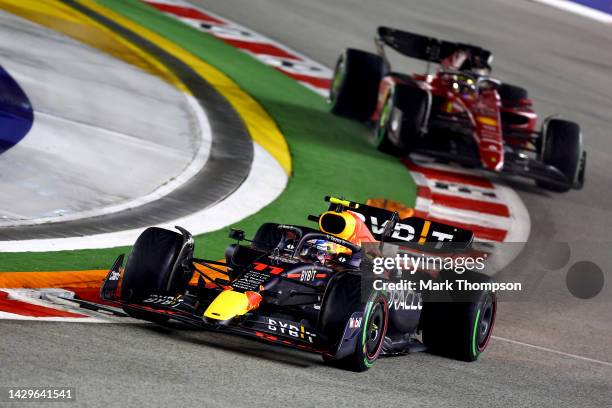 Sergio Perez of Mexico driving the Oracle Red Bull Racing RB18 leads Charles Leclerc of Monaco driving the Ferrari F1-75 during the F1 Grand Prix of...