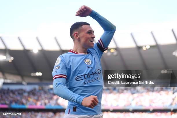 Phil Foden of Manchester City celebrates their sides fourth goal during the Premier League match between Manchester City and Manchester United at...