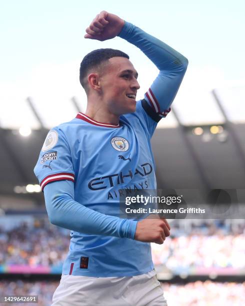 Phil Foden of Manchester City celebrates their sides fourth goal during the Premier League match between Manchester City and Manchester United at...