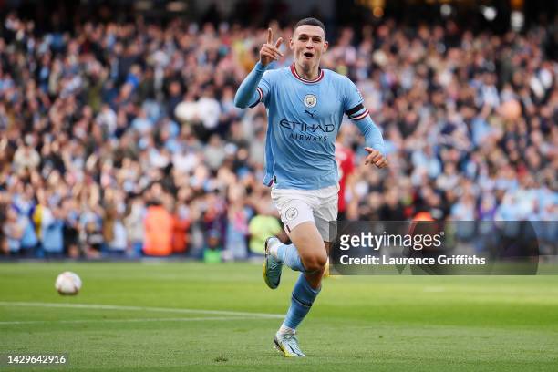 Phil Foden of Manchester City celebrates their sides fourth goal during the Premier League match between Manchester City and Manchester United at...