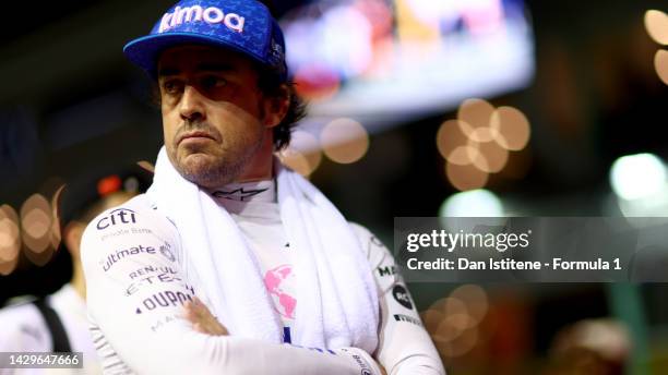 Fernando Alonso of Spain and Alpine F1 looks on from the grid during the F1 Grand Prix of Singapore at Marina Bay Street Circuit on October 02, 2022...