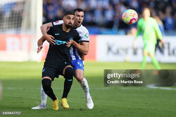 Munas Dabbur of TSG 1899 Hoffenheim is challenged by Filip Uremovic of Hertha Berlin during the Bundesliga match between Hertha BSC and TSG...