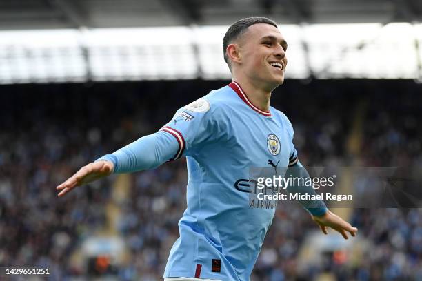 Phil Foden of Manchester City celebrates their sides sixth goal and their hat trick during the Premier League match between Manchester City and...