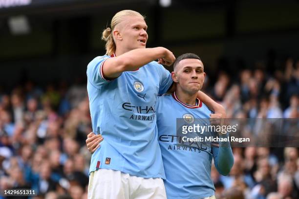 Phil Foden of Manchester City celebrates their sides sixth goal and their hat trick with team mate Erling Haaland during the Premier League match...