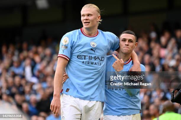 Phil Foden of Manchester City celebrates their sides sixth goal and their hat trick with team mate Erling Haaland during the Premier League match...
