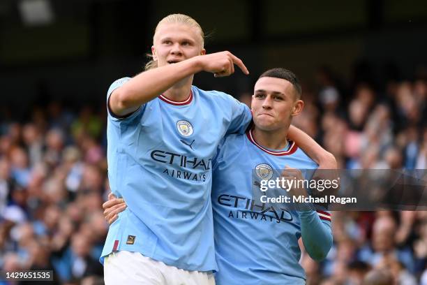 Phil Foden of Manchester City celebrates their sides sixth goal and their hat trick with team mate Erling Haaland during the Premier League match...