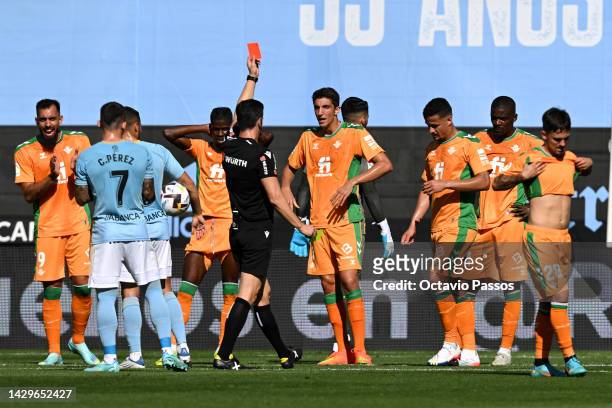 Referee Cesar Soto Grado shows a red card to Luiz Felipe of Real Betis during the LaLiga Santander match between RC Celta and Real Betis at Estadio...