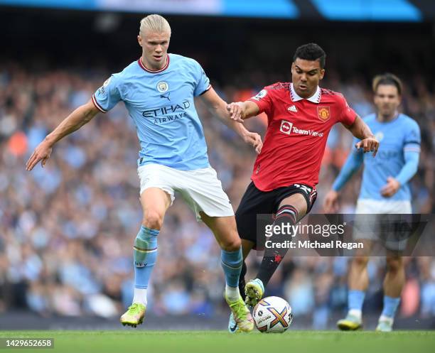 Erling Haaland of Manchester City battles for possession with Casemiro of Manchester United during the Premier League match between Manchester City...