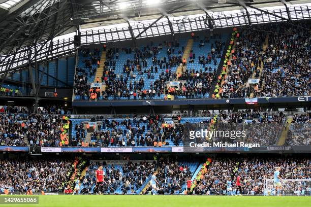 Empty seats are seen in the away end inside of the stadium during the Premier League match between Manchester City and Manchester United at Etihad...