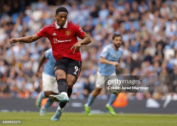 Anthony Martial of Manchester United scores their third goal during the Premier League match between Manchester City and Manchester United at Etihad...