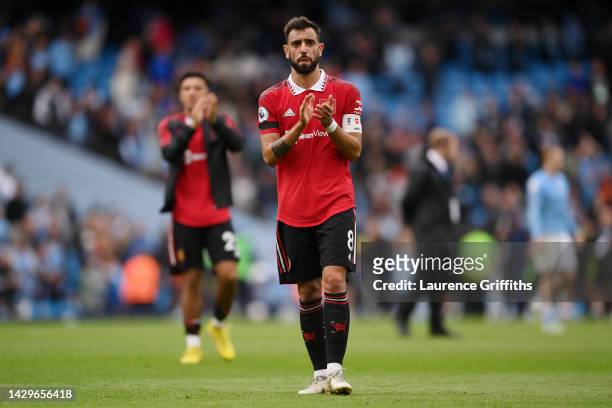 Bruno Fernandes of Manchester United interacts with the crowd following the Premier League match between Manchester City and Manchester United at...