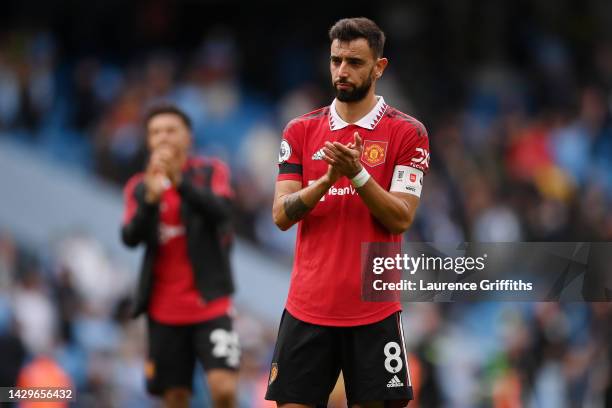Bruno Fernandes of Manchester United interacts with the crowd following the Premier League match between Manchester City and Manchester United at...