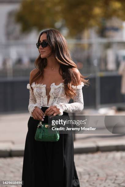 Tamara Kalinic seen wearing a total Giambattista Valli look, outside Giambattista Valli during Paris Fashion Week on September 30, 2022 in Paris,...