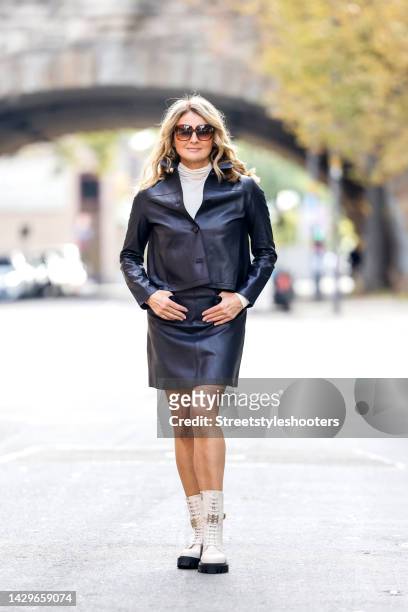 German TV host Frauke Ludowig, wearing a black leather mini skirt and a black leather short blazer by Riani, a whithe knitted turtleneck by Riani,...