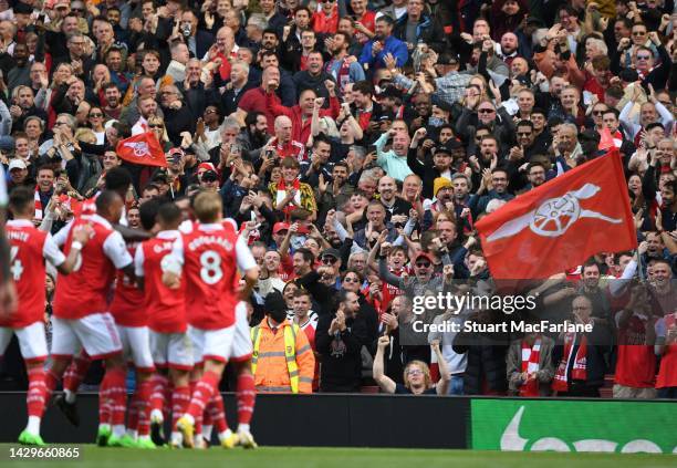 Arsenal fans celebrate the 1st goal, scored by Thomas Parte during the Premier League match between Arsenal FC and Tottenham Hotspur at Emirates...