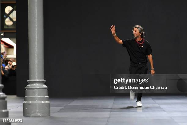 Designer Pier Paolo Piccioli cheers the public after the Valentino Womenswear Spring/Summer 2023 show as part of Paris Fashion Week on October 02,...