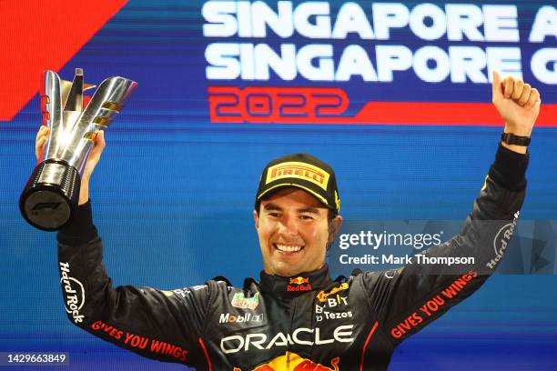 Race winner Sergio Perez of Mexico and Oracle Red Bull Racing celebrates on the podium during the F1 Grand Prix of Singapore at Marina Bay Street...