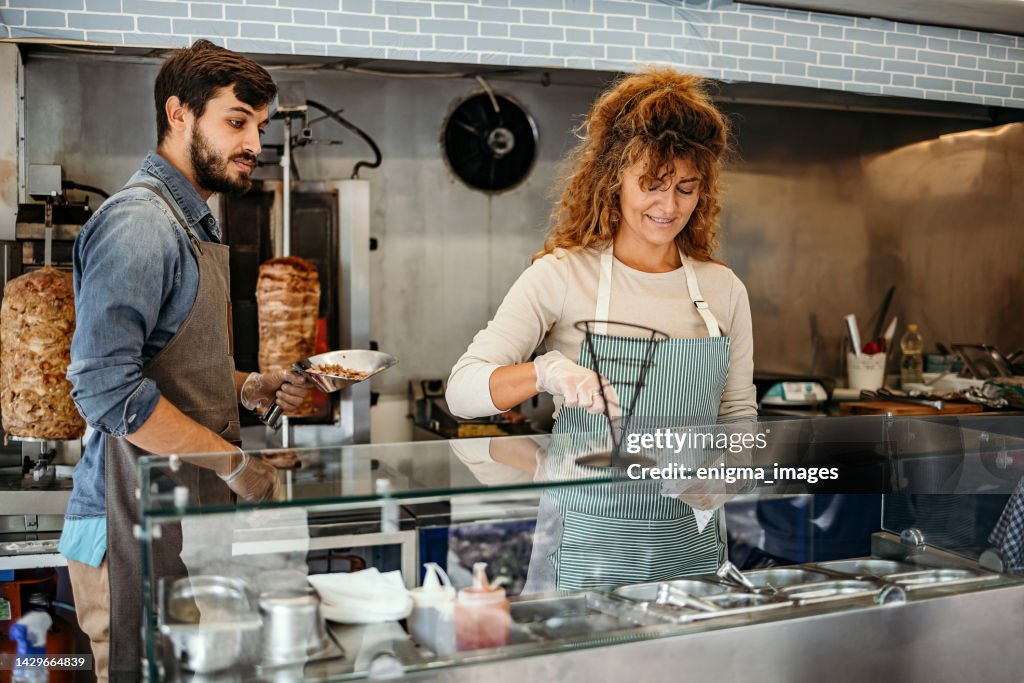 Working Class Food Example Two People Working In Food Truck High-Res Stock Photo - Getty Images