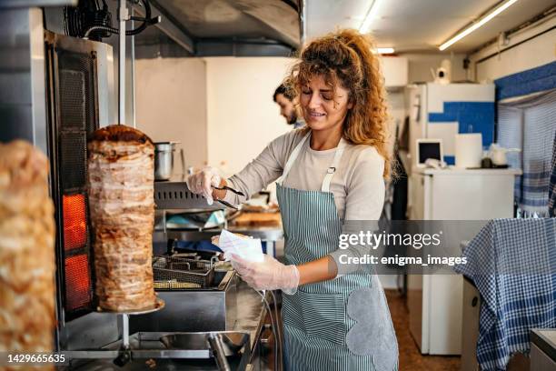 two people working in food truck - doner kebab stock pictures, royalty-free photos & images