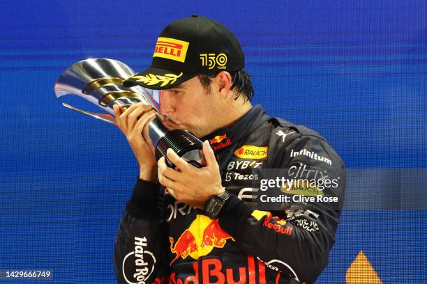 Race winner Sergio Perez of Mexico and Oracle Red Bull Racing celebrates on the podium during the F1 Grand Prix of Singapore at Marina Bay Street...