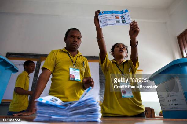 Election workers hold up ballots as the counting continues in the run-off Presidential elections on April 16, 2012 in Dili, East Timor. Voter turnout...