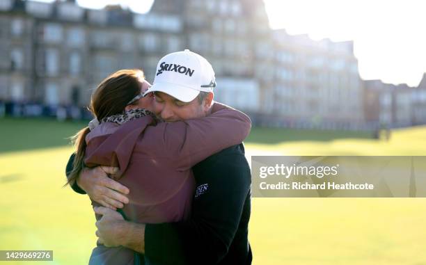 Ryan Fox of New Zealand embraces their Wife, Anneke after finishing their round on Day Four of the Alfred Dunhill Links Championship on the Old...